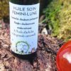 Huile botanique Endo-Calm utilisée en massage du bas-ventre pour accompagner les douleurs menstruelles.